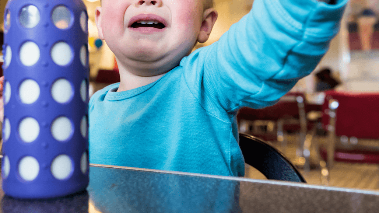 A baby crying in a restaurant.