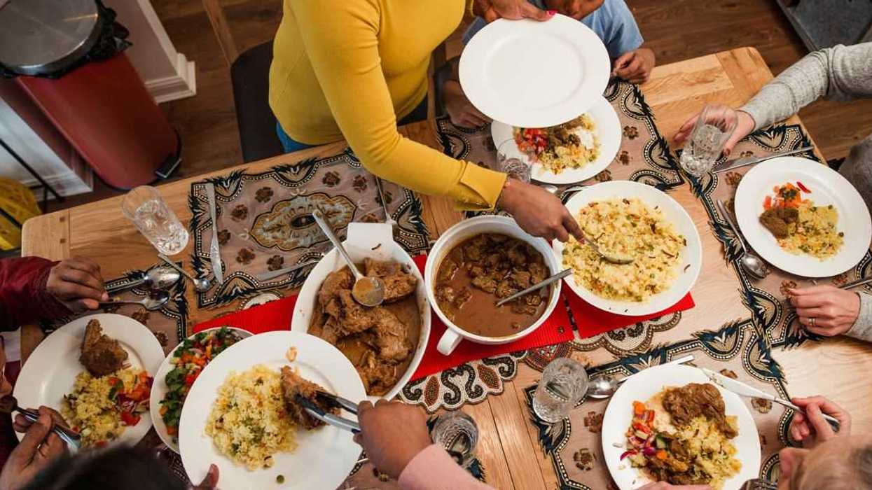 A Bangladeshi family eats a traditional meal