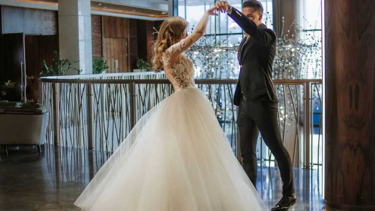 A bride and groom dance