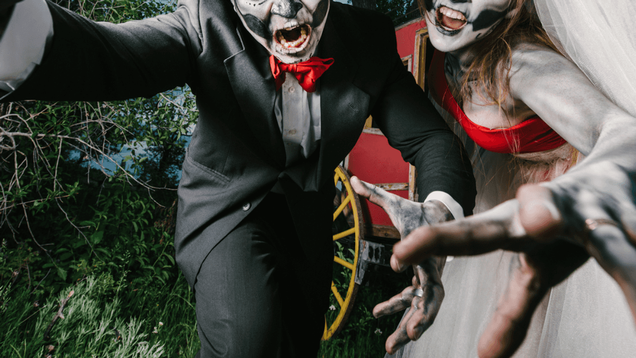 A bride and groom in a halloween wedding