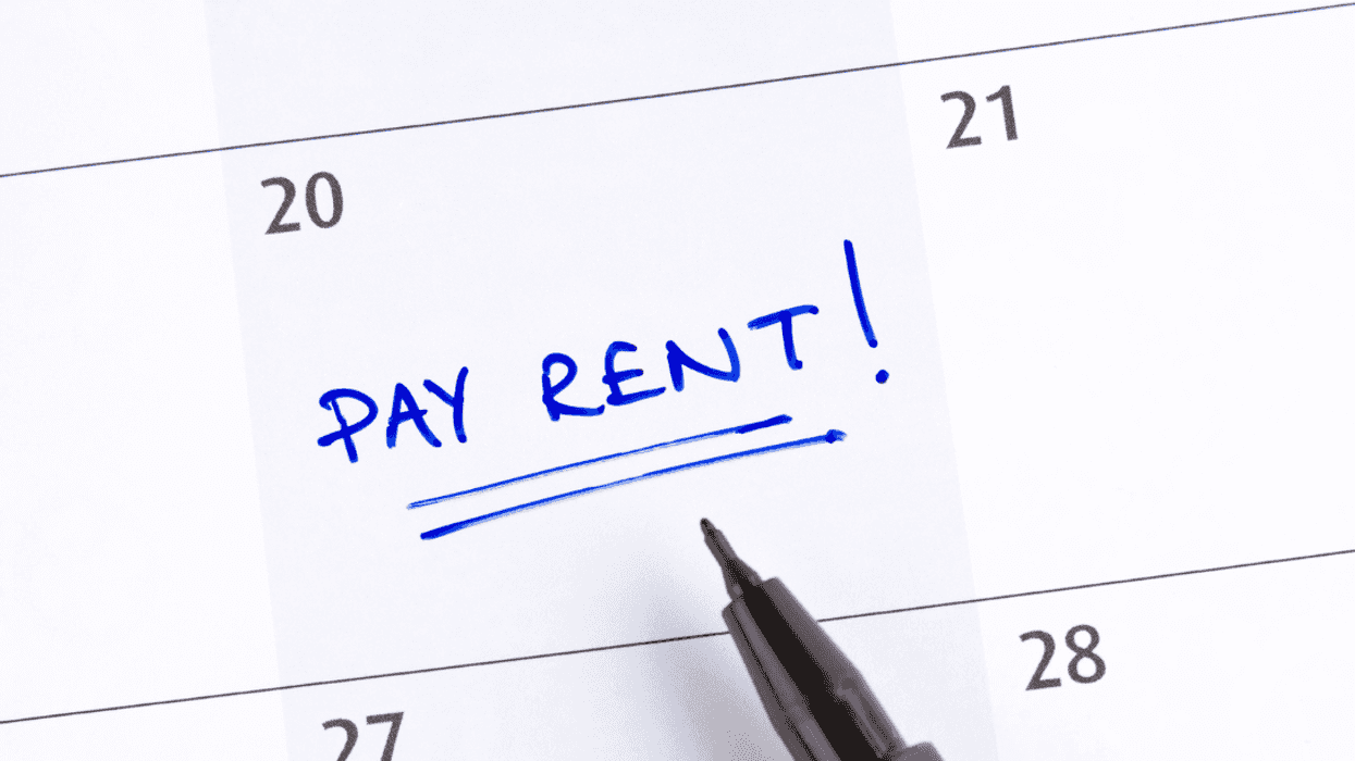 A calendar with "pay rent" written on it.