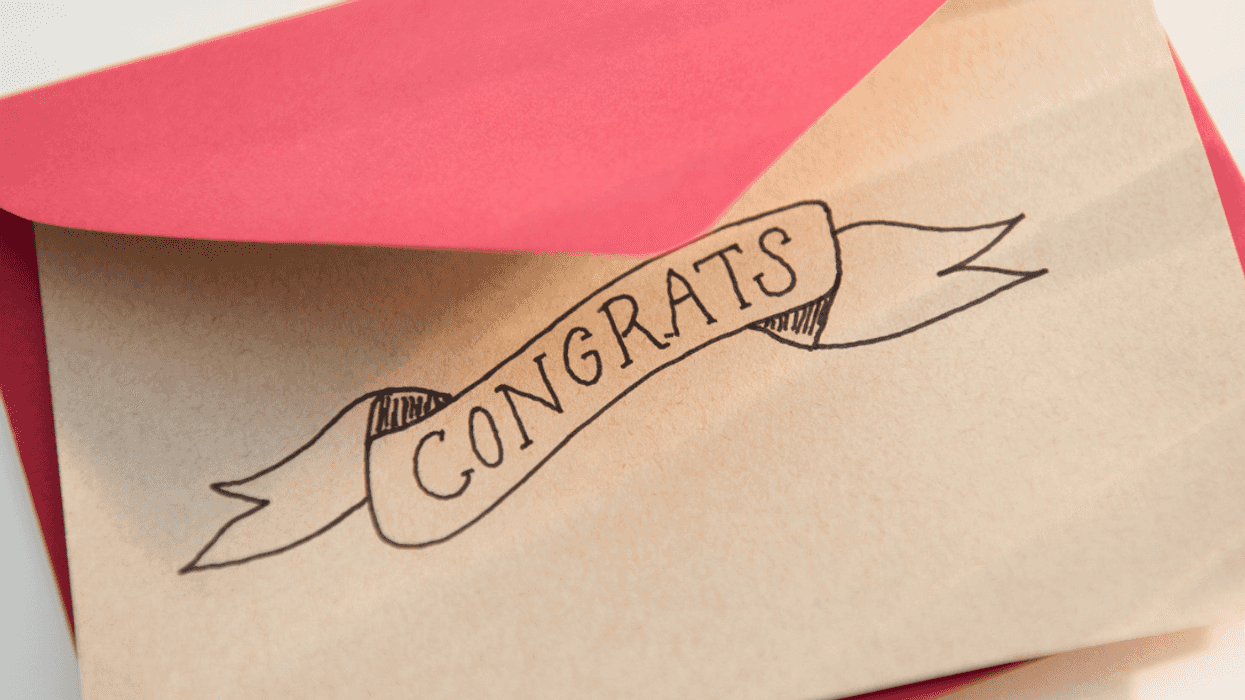 A card under a red envelope with "congrats" written on it.