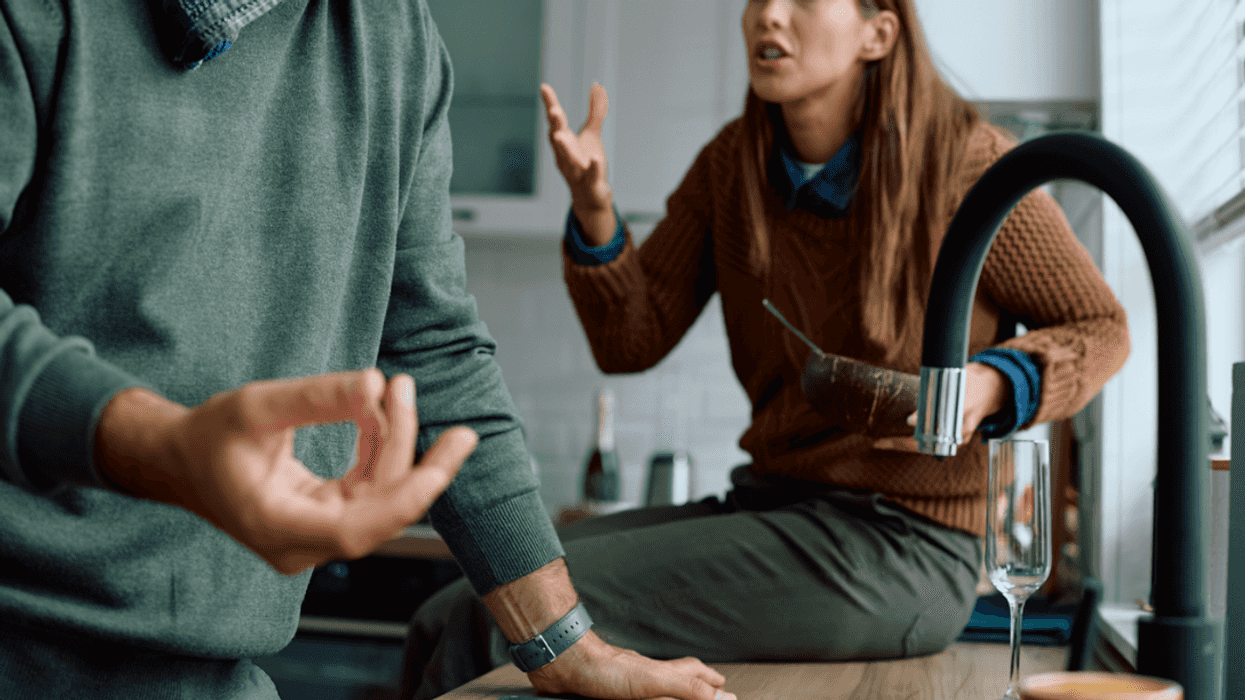A couple having an argument in the kitchen