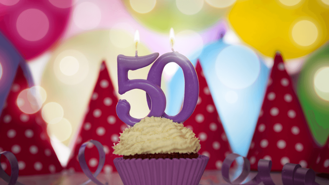 A cupcake with 50th birthday candles.