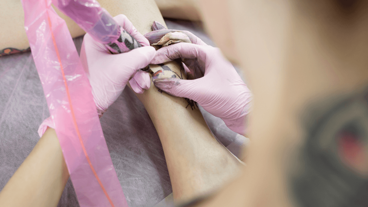 A girl getting a tattoo.