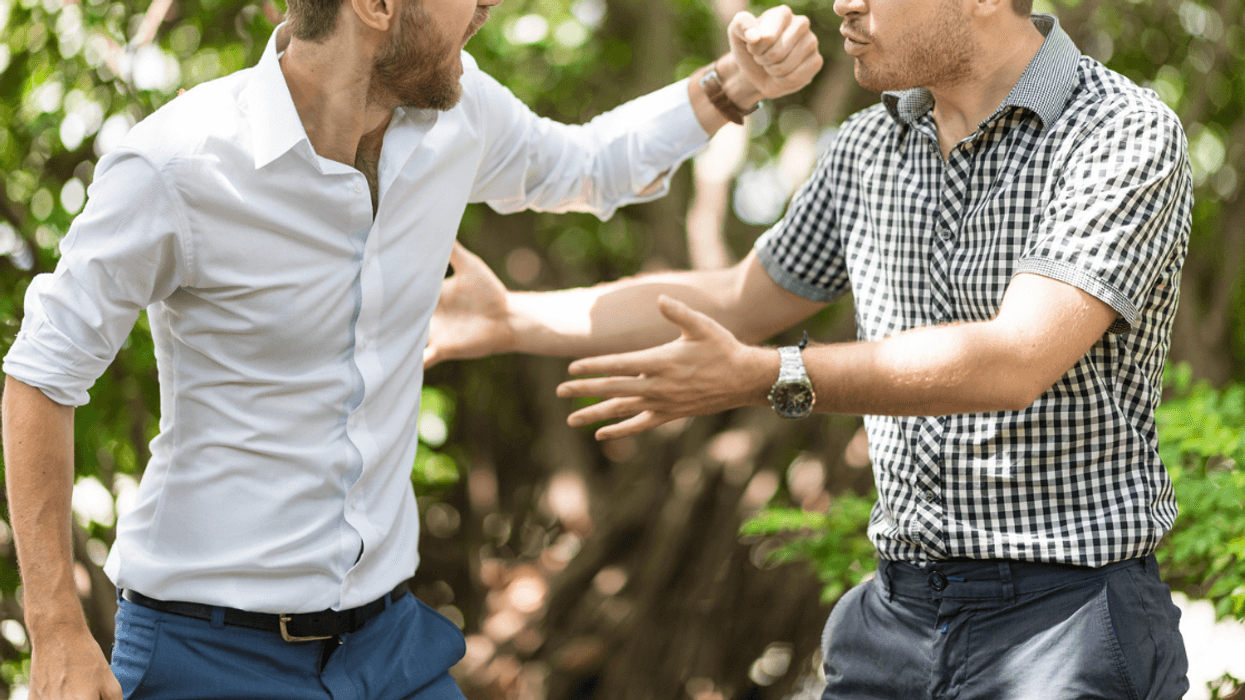 A groom arguing with his best man