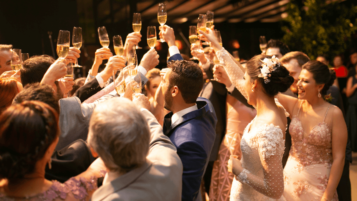 A group of people raising glasses for a toast