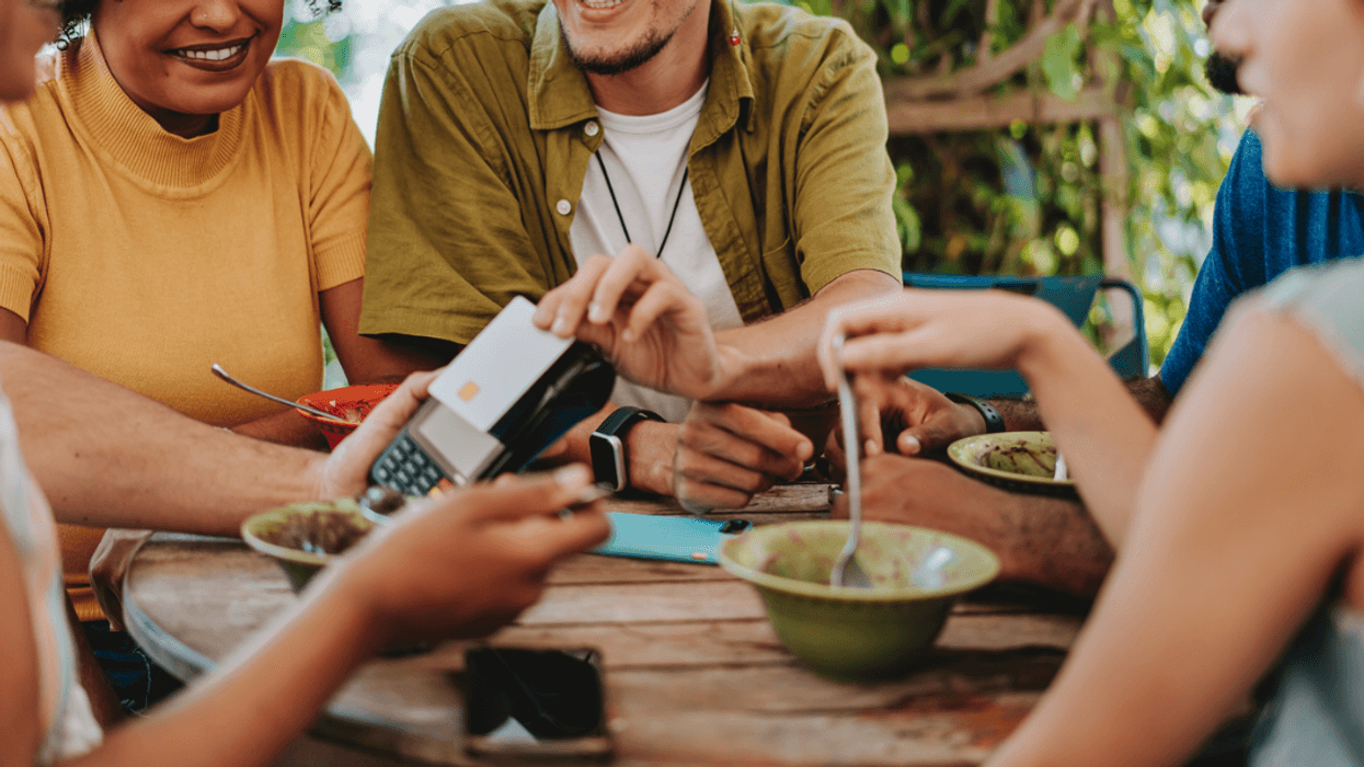 A group of people splitting a check.