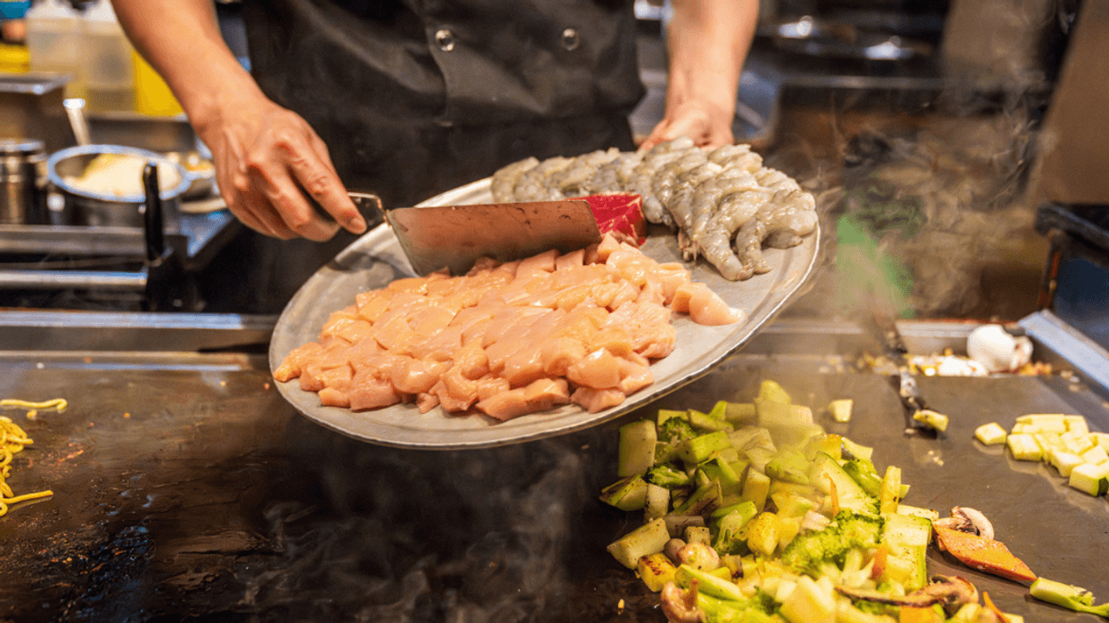 A Hibachi Chef cooking on a hibachi table