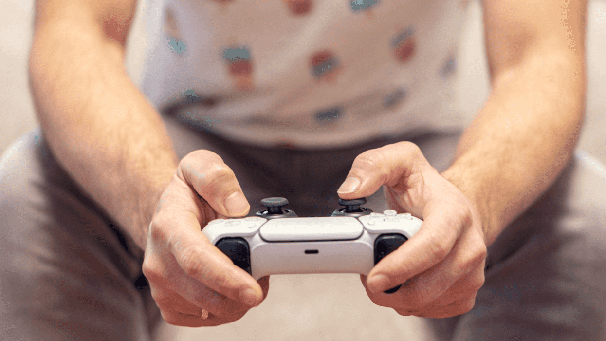A man holding a video game controller.