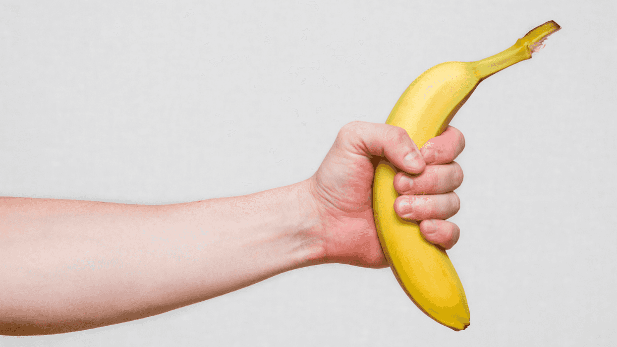 A man holding out a bannana