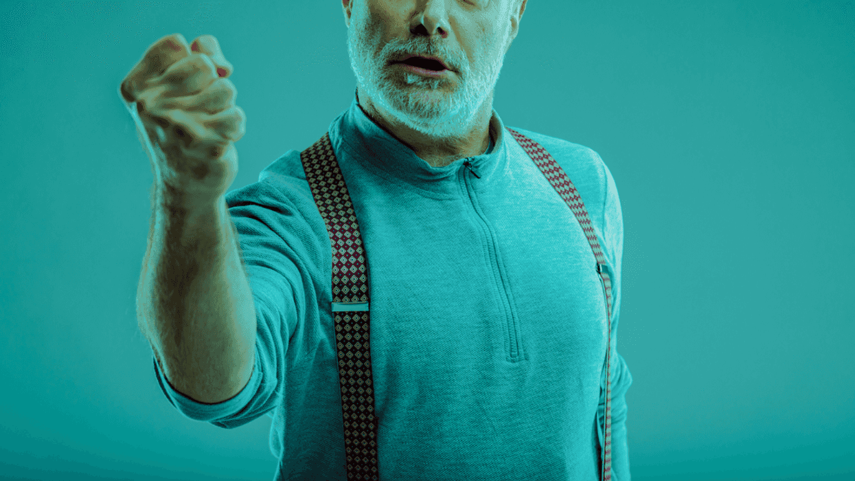 A man shaking his arm in a tinted green glaze.