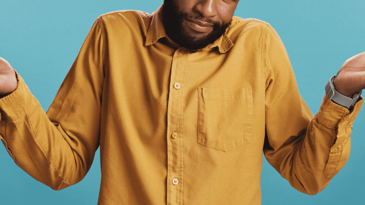 A man shrugging his shoulders.