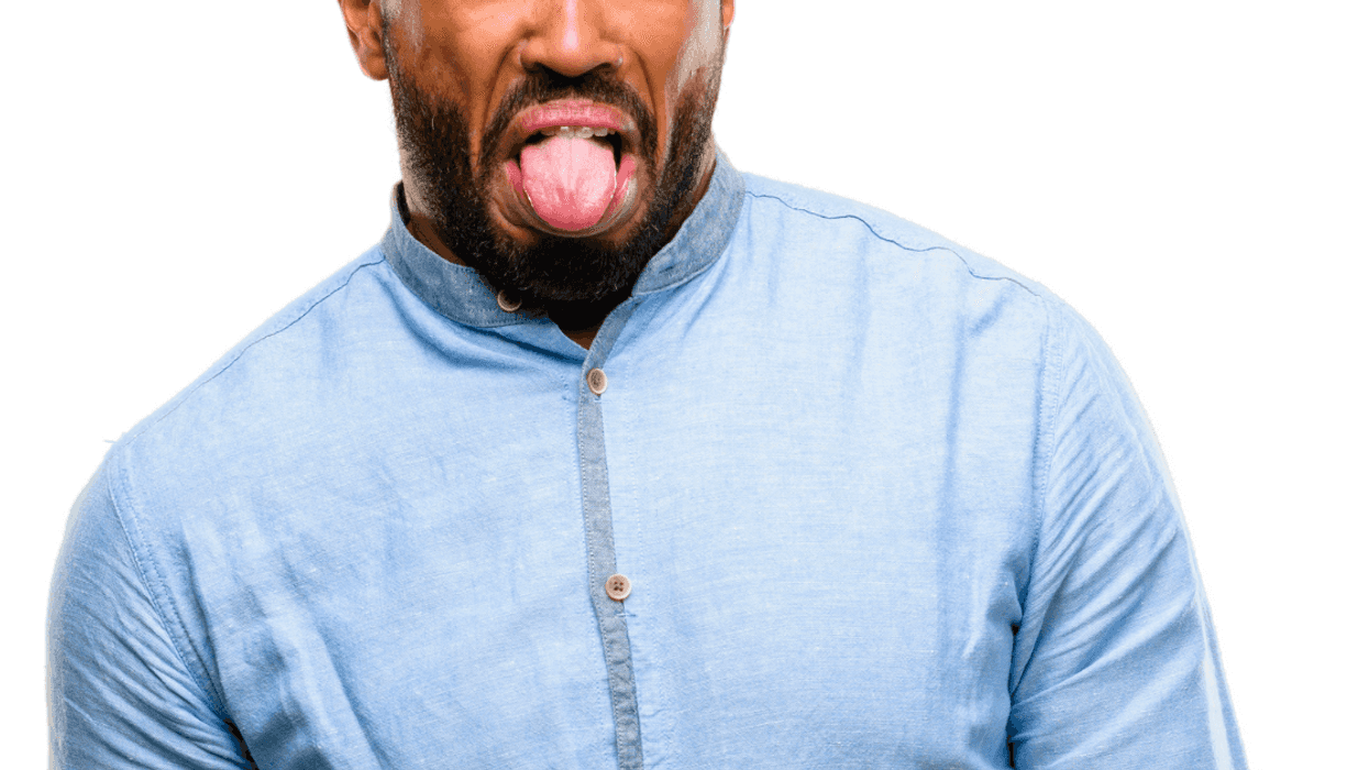 A man sticking his tongue out.