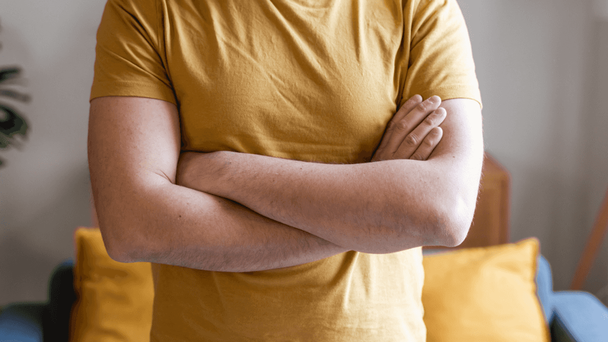 A man with his arms folded.