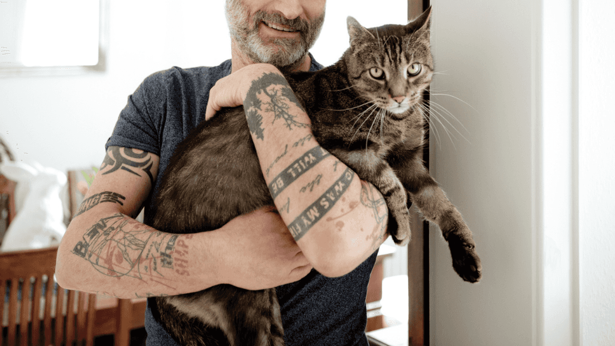 A man with his beloved house cat