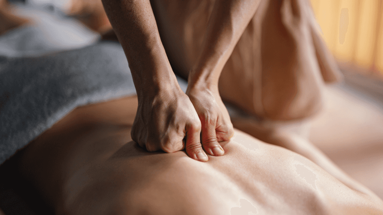 A masseuse giving a massage.