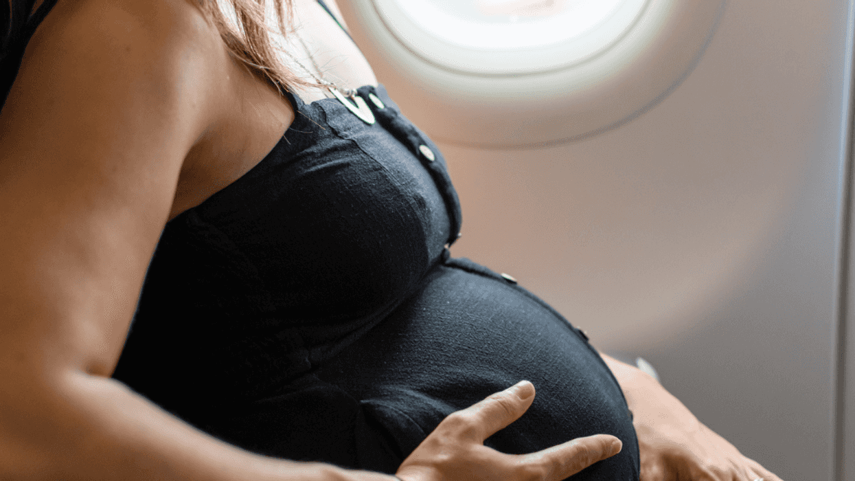 A pregnant woman on a plane