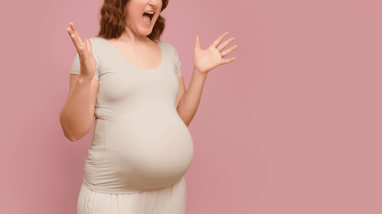 A pregnant woman screaming.