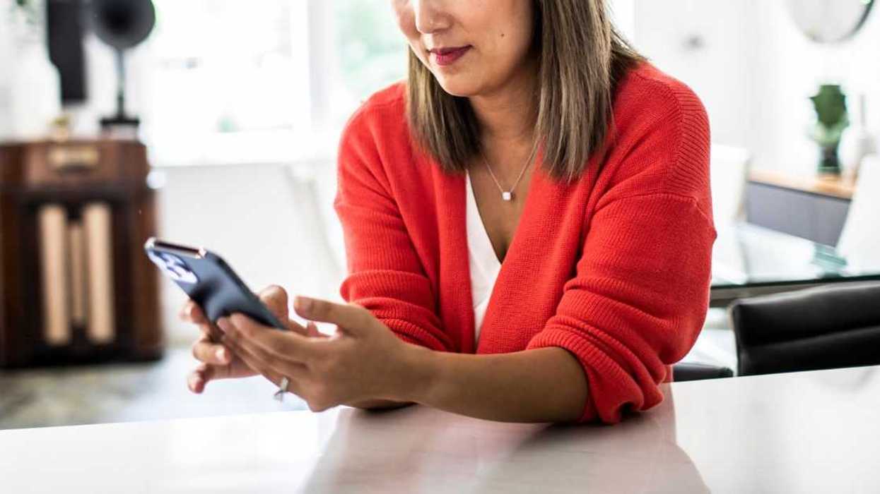 A woman at home texts