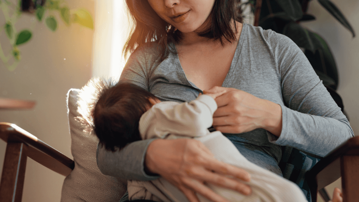 A woman breastfeeding her baby.