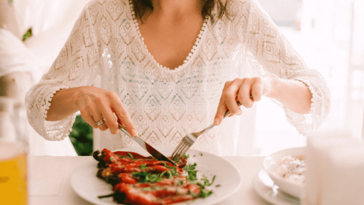 A woman eating a Keto-friendly meal