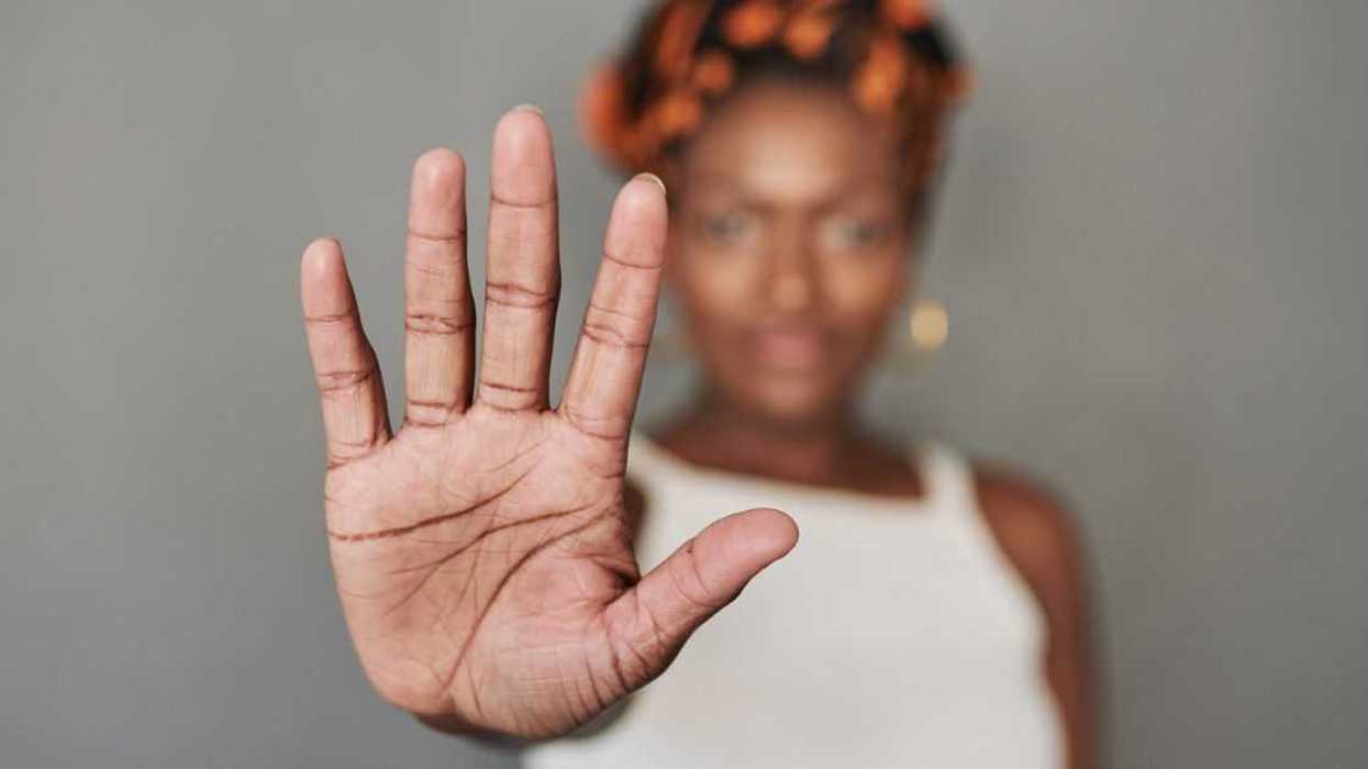 A woman putting her palm out