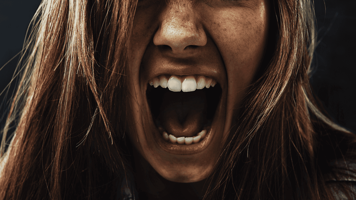 A woman screaming.