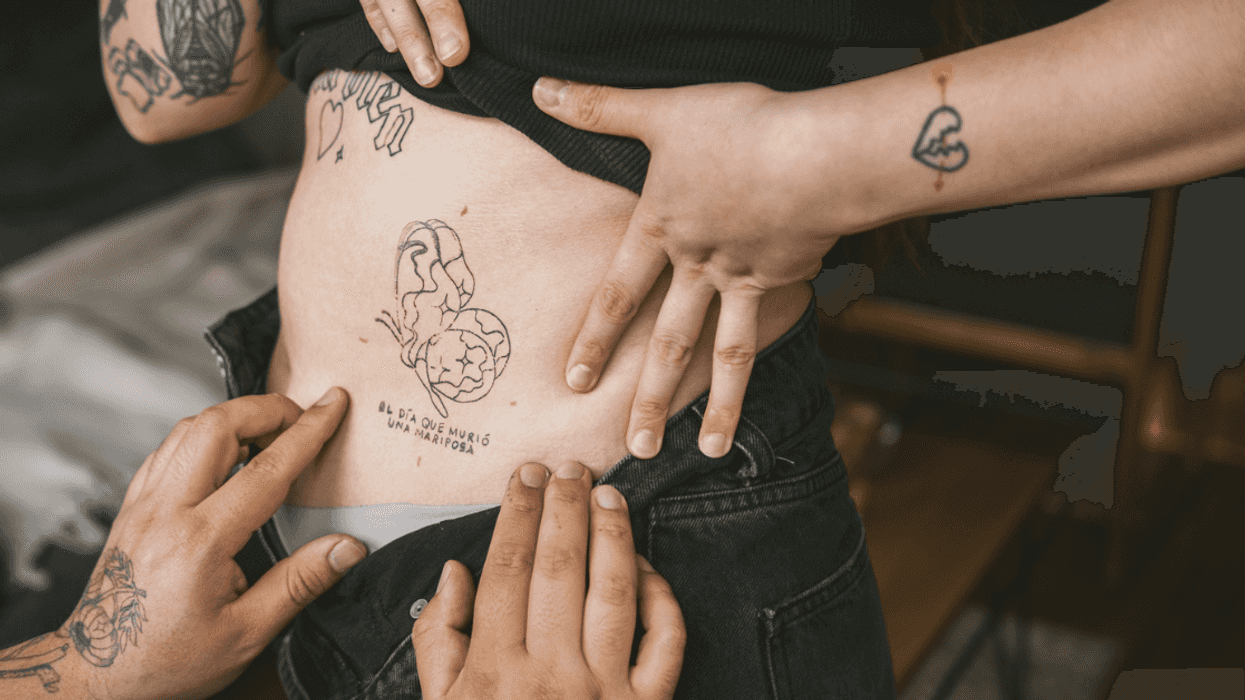 A woman showing off her tattoos