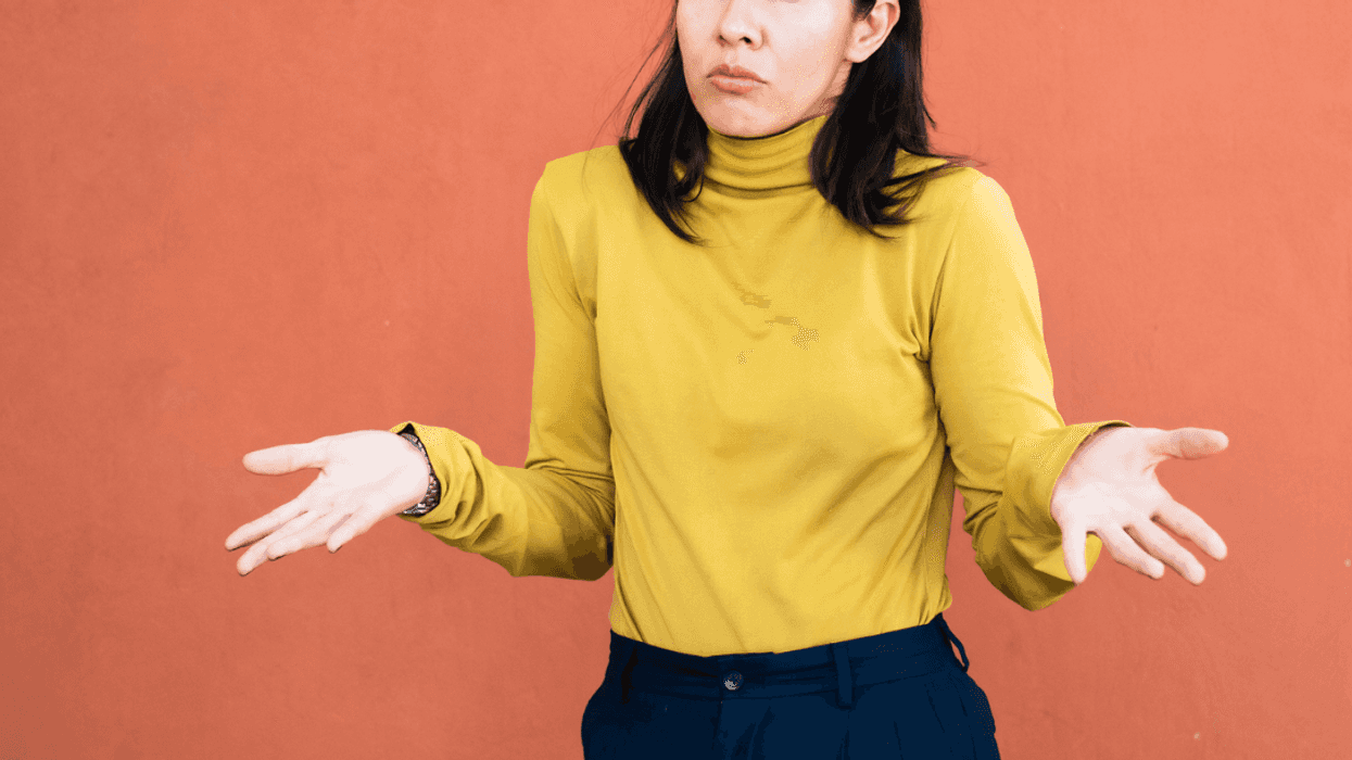 A woman shrugging her shoulders