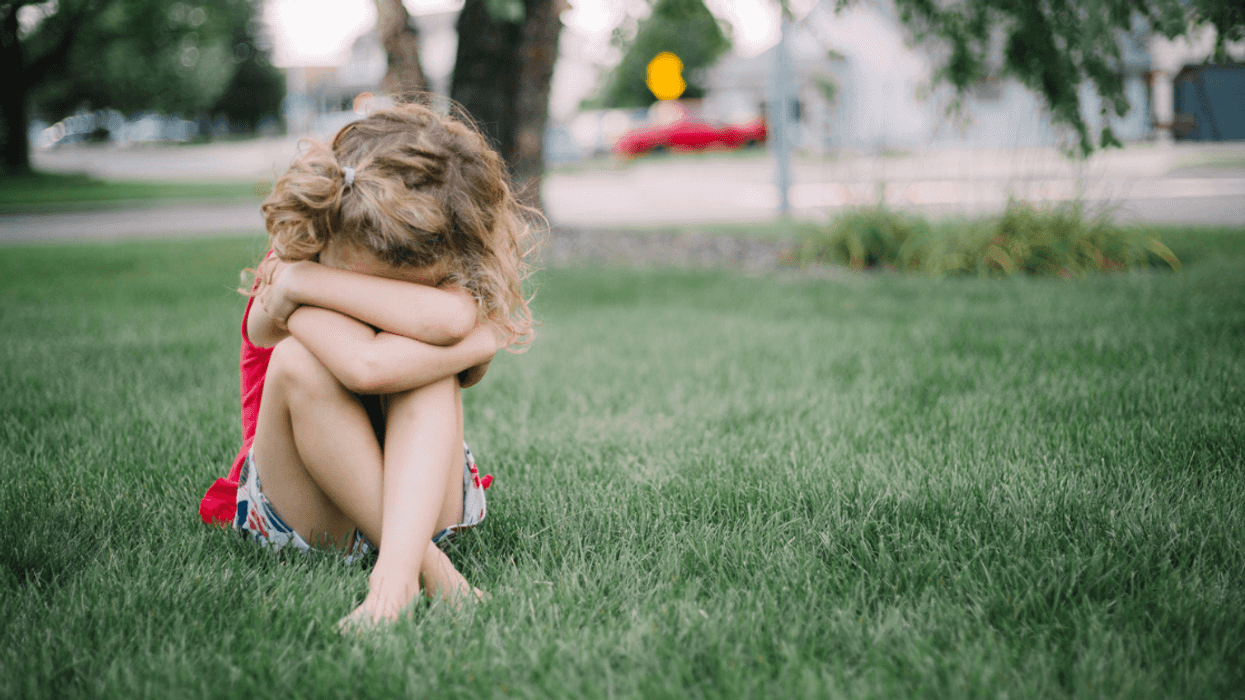 A young girl crying