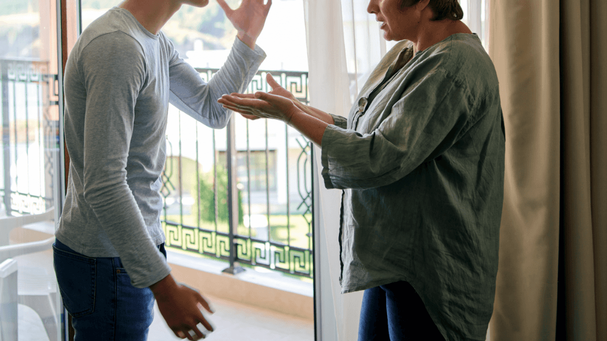 A young man and a middle aged woman having an argument.
