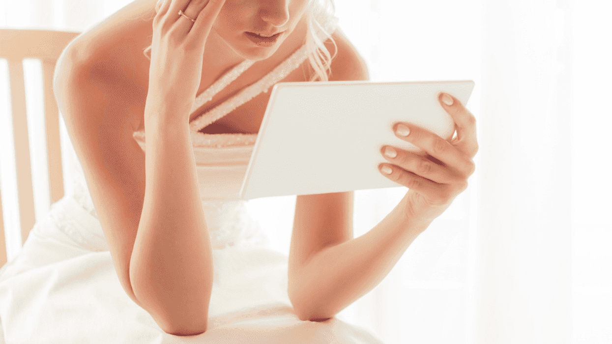 Angry bride looking at an important piece of paper