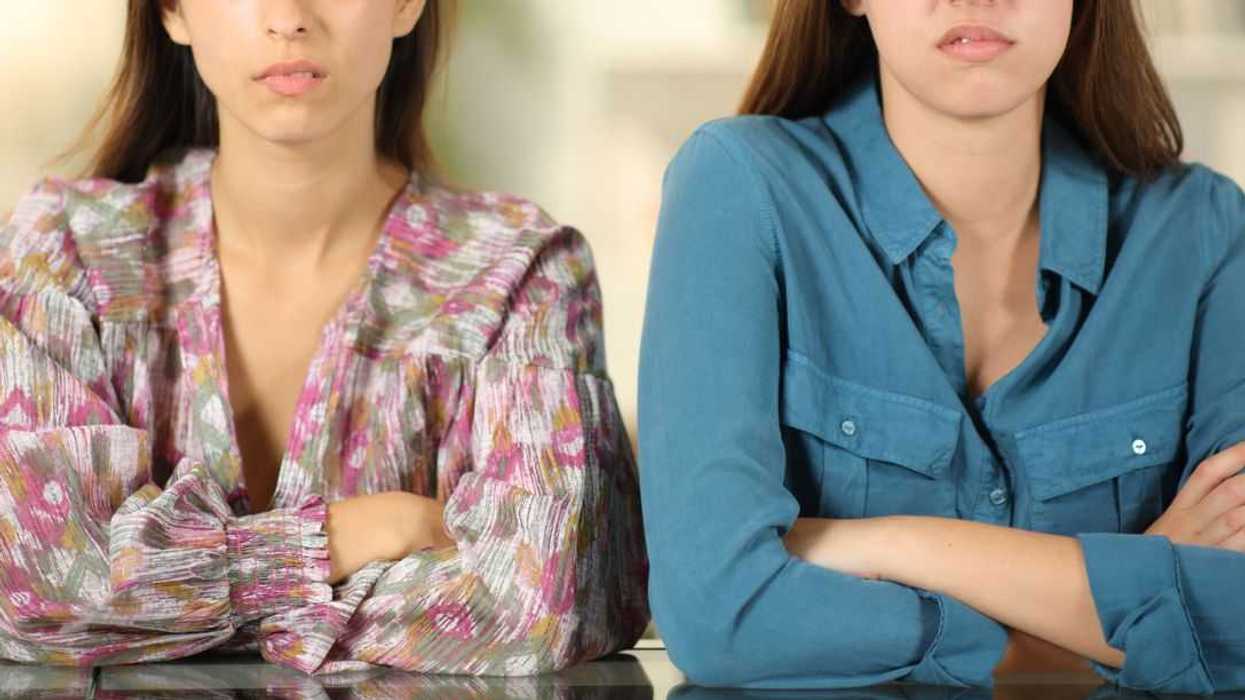 Angry friends ignoring each other at home.