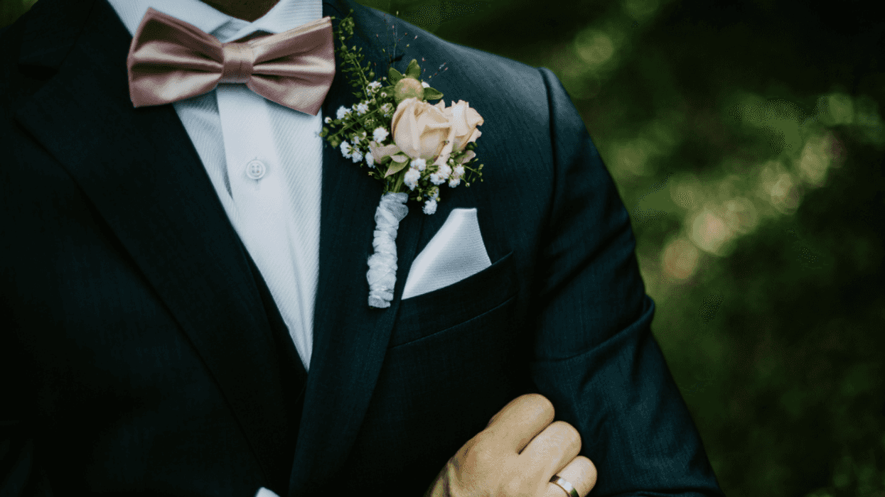 Angry groom with his arms crossed