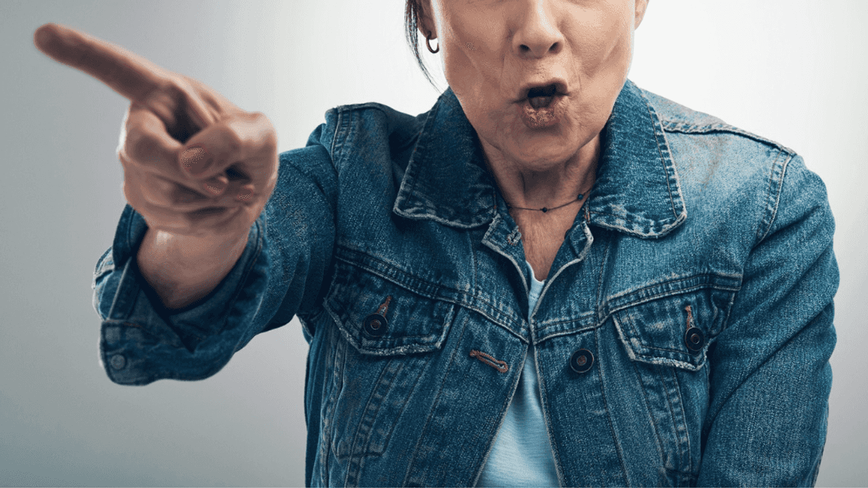 angry older woman pointing her finger while speaking