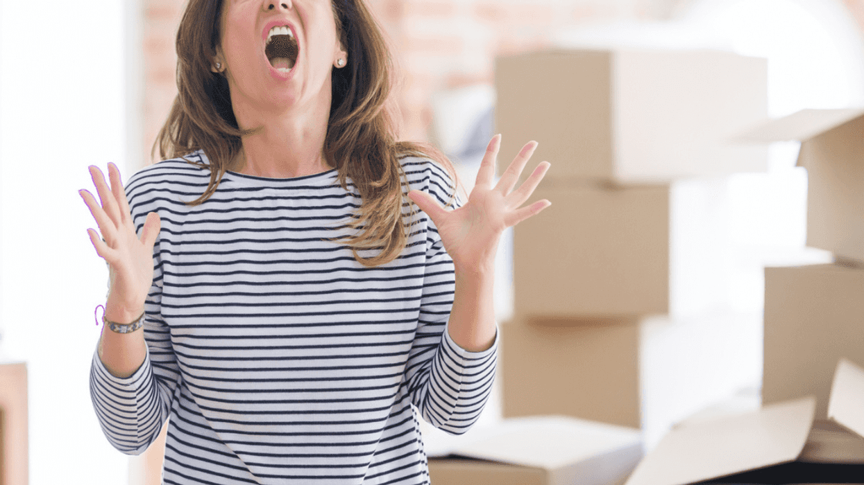 Angry woman with moving boxes
