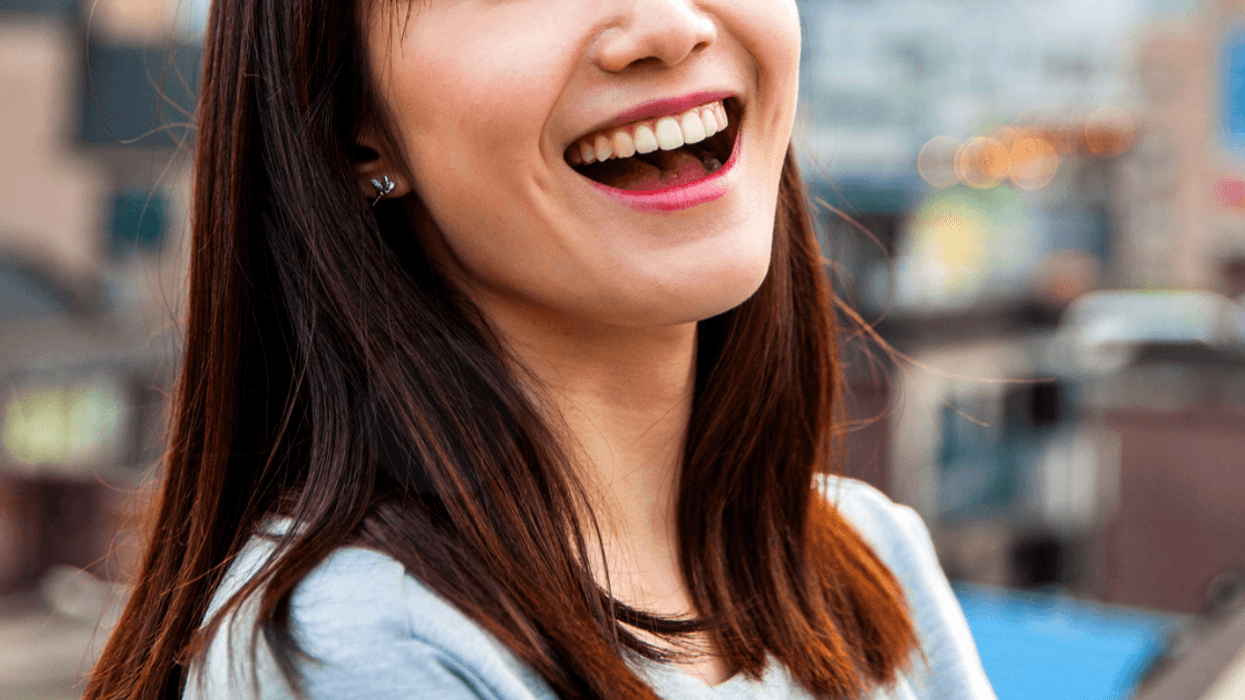 Asian woman laughing