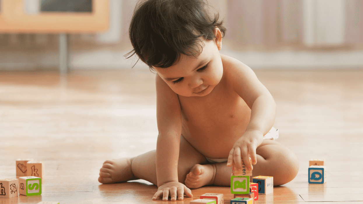 baby playing with blocks