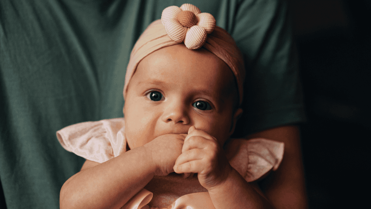 Baby wearing a flower