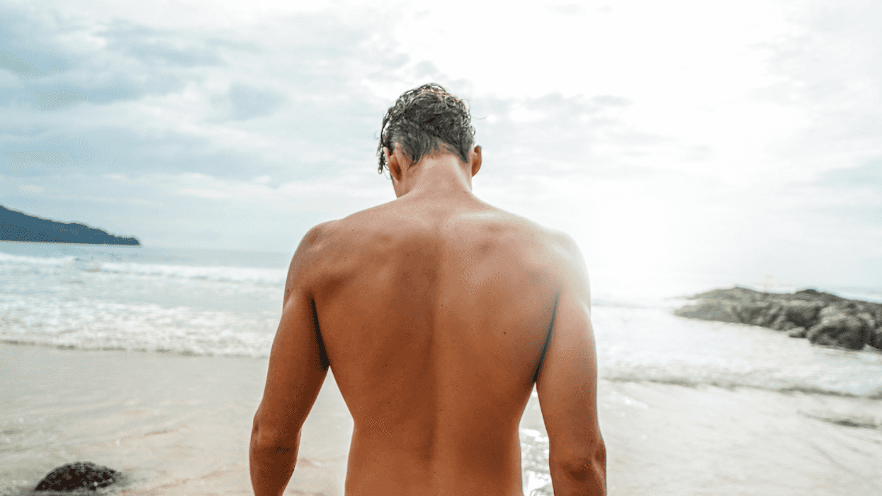 back of attractive man on a beach