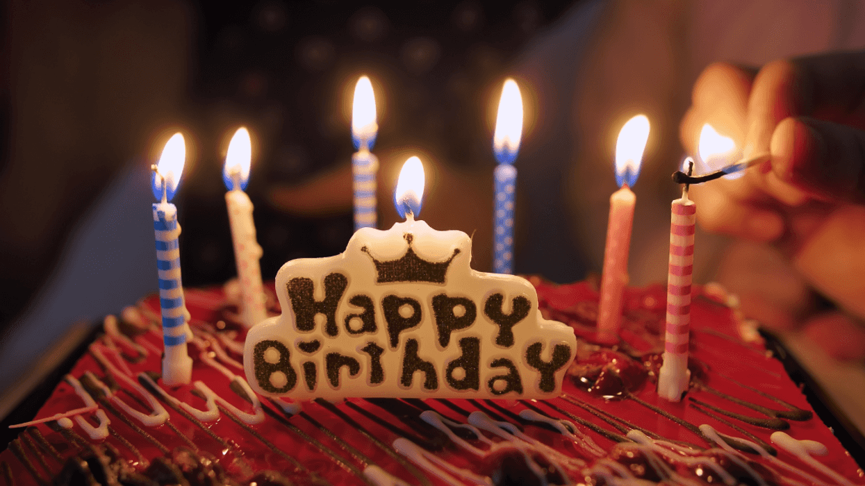 birthday cake candles being lit