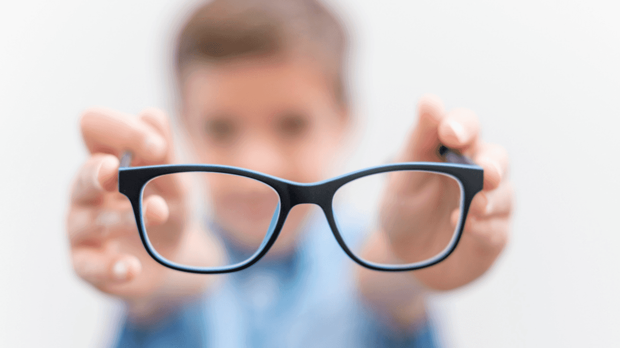 boy holding eyeglasses