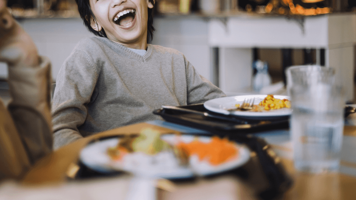Boy laughing in school cafeteria