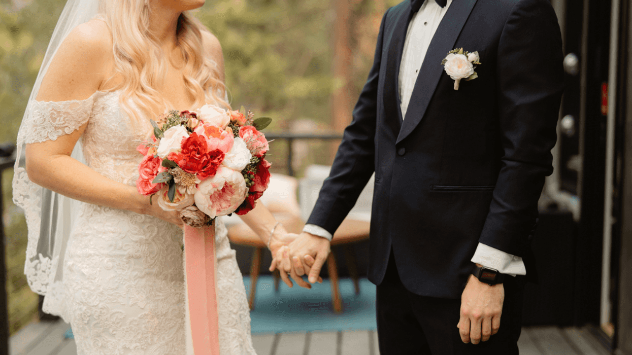 briade and groom holding hands on porch