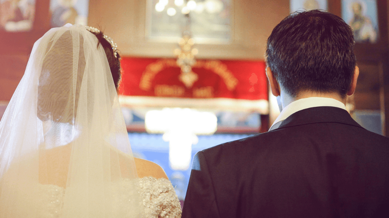 bride and groom at altar