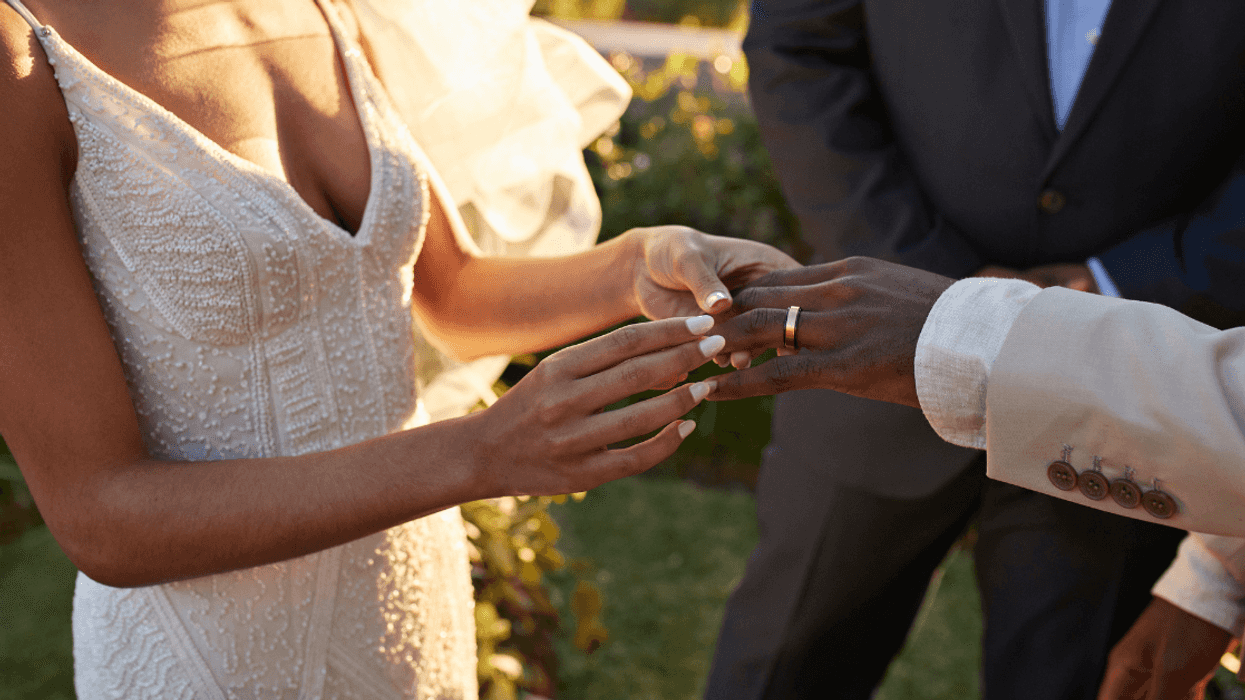 Bride and groom exchanging rings