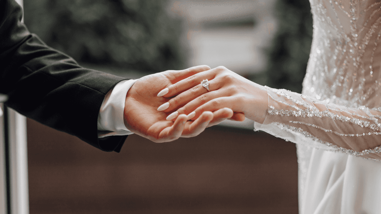 Bride and groom holding hands