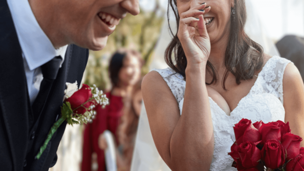bride and groom laughing together