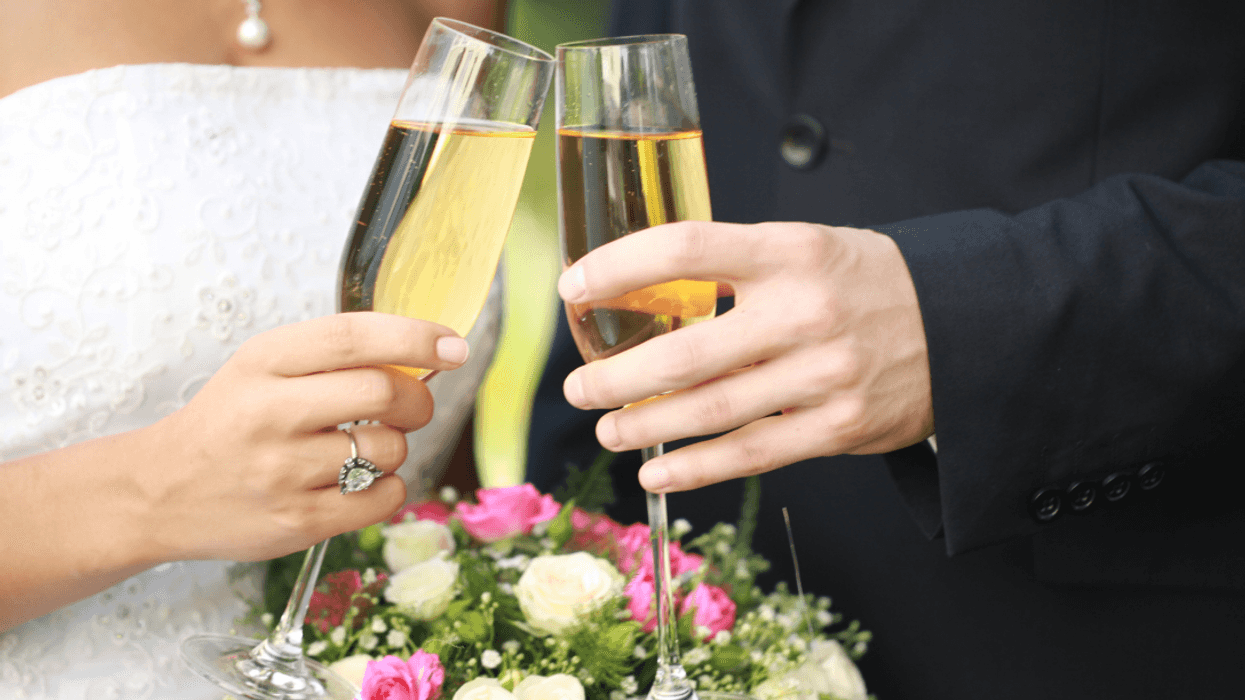bride and groom toasting with champagne
